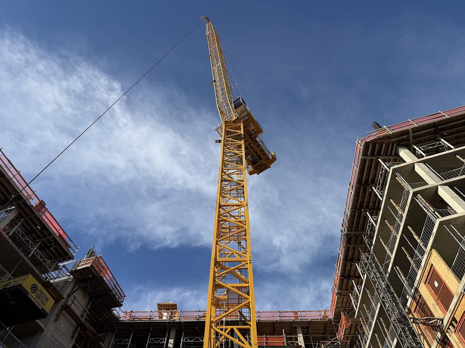Tower crane above a building under construction